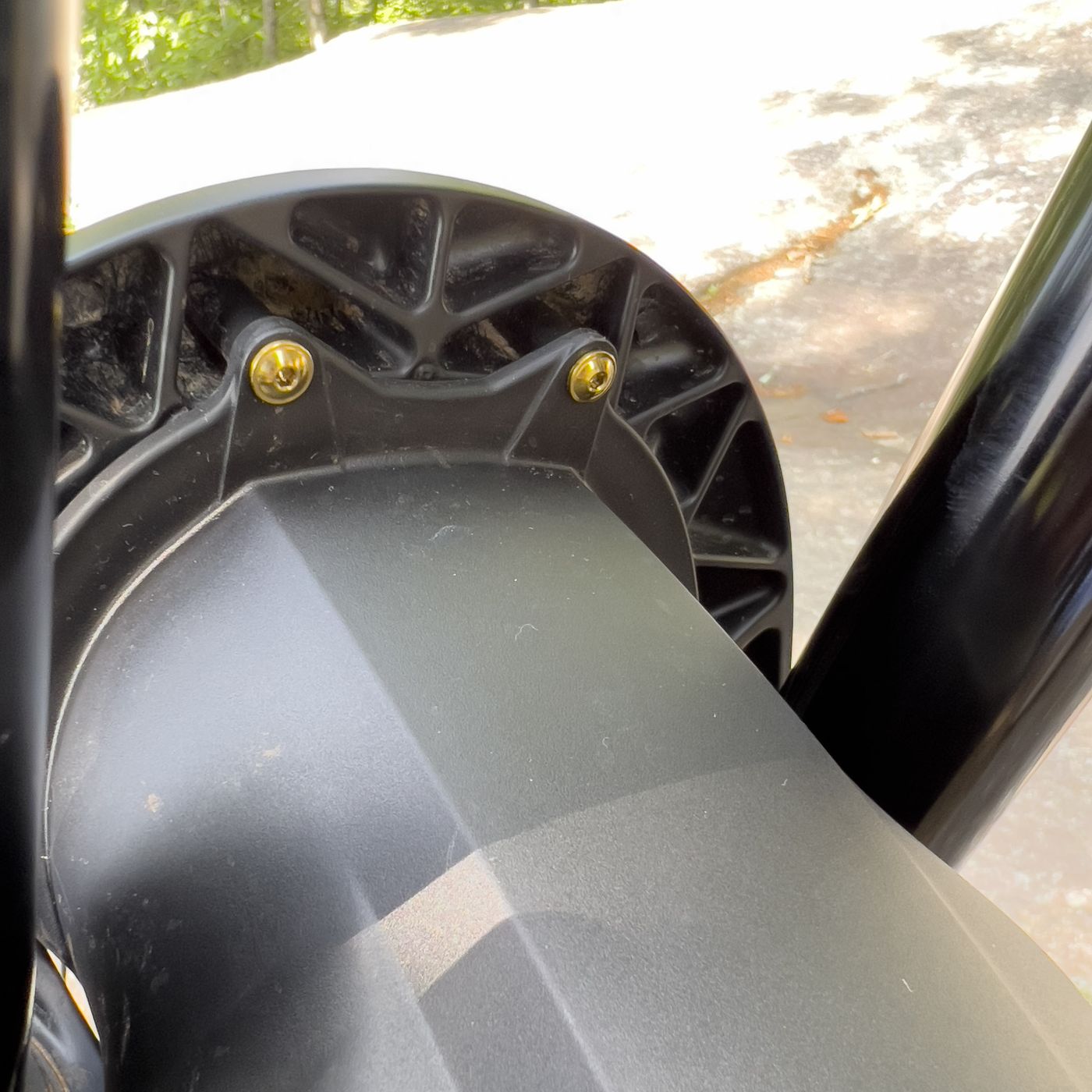 Gold titanium bolts on a suspension fork
